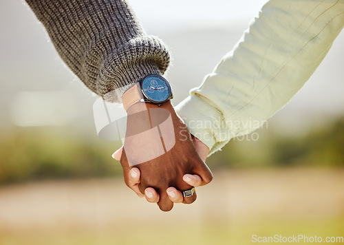 Image of Love, trust and couple holding hands in nature for spring, support and happy in park together. Unity, summer and hope with hands of man and woman in countryside park for partnership, health and time