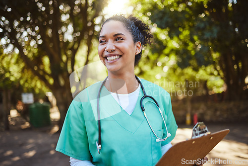 Image of Woman, nurse and smile with clipboard in the park for healthcare, medical or consultation and assistance. Happy female doctor or veterinary in nursing check, inspection or prescription advice outside