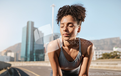 Image of Fitness, tired woman and runner on a break in the city after running exercise, training or cardio workout in the outdoors. Exhausted female taking a breath from exercising or run in a urban town