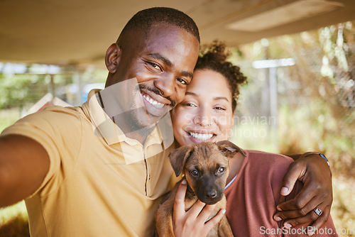 Image of Love, dog and selfie with a couple and their adopted pet posing for a picture together in their new home. Portrait, puppy and adoption with a man, woman and foster animal taking a photograph