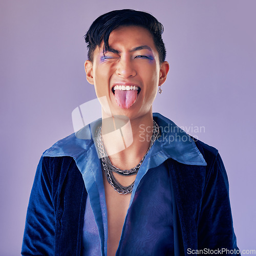 Image of Fashion, purple and crazy punk model with creative eyeliner, makeup design or facial cosmetics for beauty aesthetics. Portrait, creativity and retro Asian man with vintage clothes, energy and style