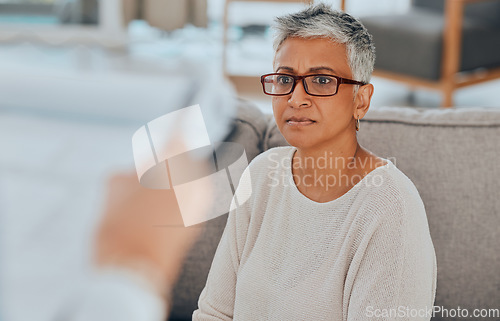 Image of Senior woman, worried and stress while on living room sofa thinking and feeling stressed, anxiety and depression with glasses. Elderly lady in retirement with dementia, alzheimer or health problem