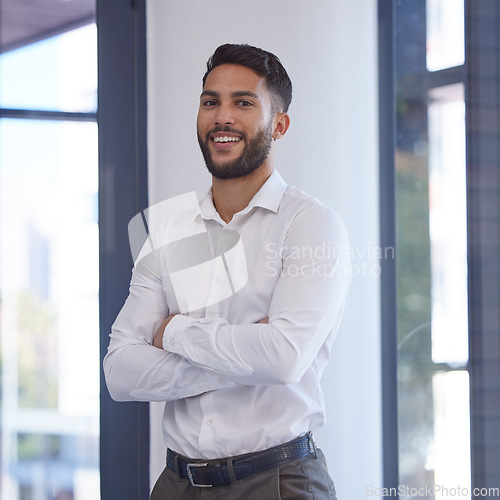 Image of Confident businessman, portrait smile and arms crossed with vision, ambition or mission for success at the office. Happy man smiling in management for business objects, tasks or company goals at work