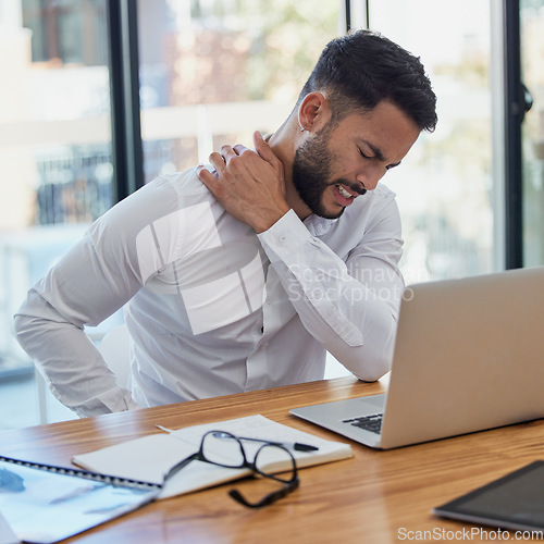 Image of Man, shoulder pain and laptop while working in office suffering from stress, depression and burnout at desk. Arab businessman sitting to massage body feeling tired and fatigue