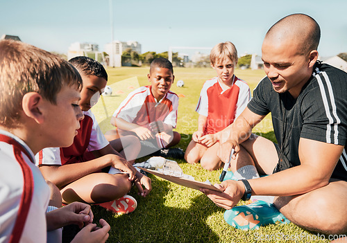 Image of Soccer, football coach with team talk and strategy with tactics winning game sitting on grass training field. Boy children athletes, teamwork and motivation to win youth kids sport competition match