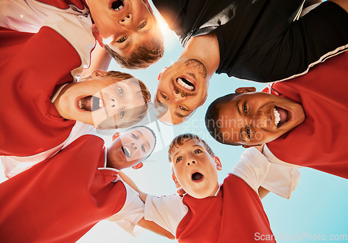 Image of Soccer, team and coach in huddle, celebration and happy with smile, winner and boy group from bottom. Football kids, excited or children teamwork for fitness, training or workout after game or match