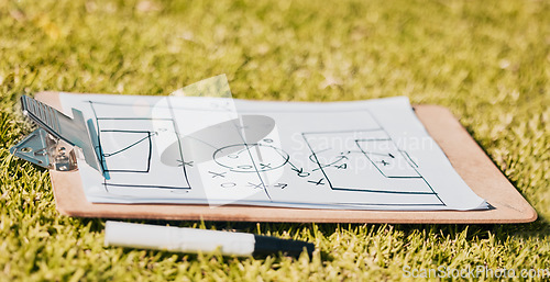 Image of Clipboard, paper and soccer strategy, planning with tactics for team game plan and formation on a grass sport field. Document, pen and icon drawing, sketch and football plan for match on sports pitch