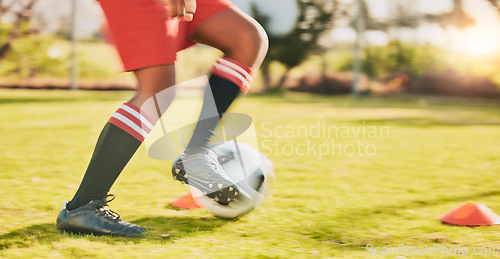 Image of Sports, soccer player and legs of child practice for youth competition, speed action game or dynamic fitness match. Football commitment motivation, training field cone and agile kid running with ball