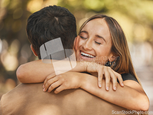 Image of Love, hug and couple at park, nature or outdoors on date, vacation or holiday. Happy, smile and man and woman hugging, embrace or cuddle with affection or bonding while enjoying quality time together