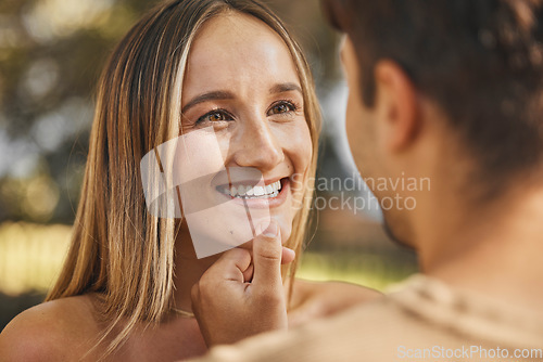 Image of Love, man touching woman chin for happiness, intimacy and bonding being loving, happy or smile together. Romance, couple or connect for relationship for quality time, passionate or embrace on holiday