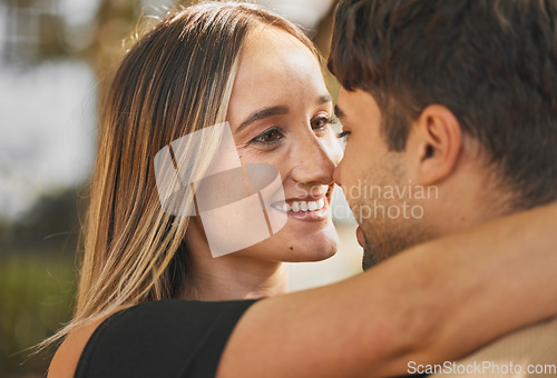 Image of Love, couple and hug with kiss, smile and bonding together for relationship, marriage and happy. Romance, man and woman being intimate, embrace and romantic for happiness, connect and quality time.