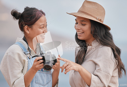 Image of Photo, photographer and model with a camera for a photo shoot at the beach, nature or during travel of Portugal together. Decision, choice and friends happy with outdoor photography on vintage camera