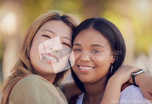 Image of Friends, hug and love outdoor in nature park for fun, support and bonding outdoor with a smile, happiness and trust. Face portrait of asian and black woman lesbian, couple outdoor for travel and fun