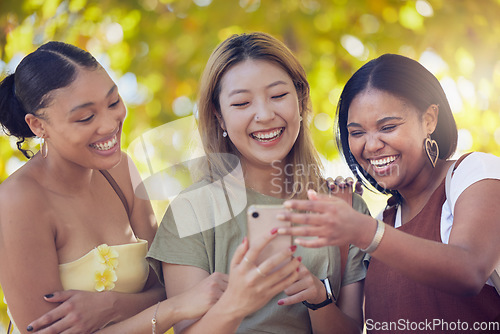 Image of Smartphone, park and women friends with funny social media update, reading blog or networking for spring outdoor wellness. Happy people in nature using phone for location check, app or online search