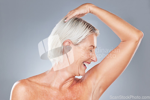 Image of Beauty, hygiene and woman in antiaging with skincare advertising, healthy skin and grooming with pose against grey studio background. Happy, senior model and natural cosmetics with body wellness.