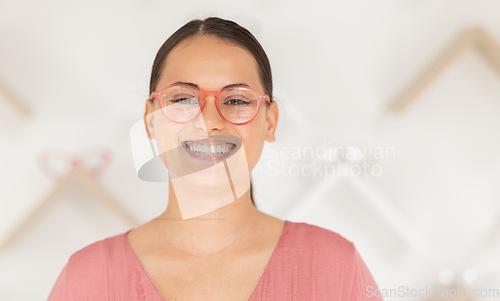 Image of Face, glasses and vision with a woman at an optometrist for an eye test or buying prescription lenses. Portrait, retail and eyewear with a female customer shopping for frame spectacles at an optician