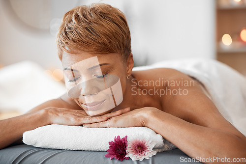 Image of Wellness, massage and black woman at spa sleeping on cosmetology salon bed for relaxing back treatment. Relax, peace and calm client ready for professional beauty and luxury body care service.