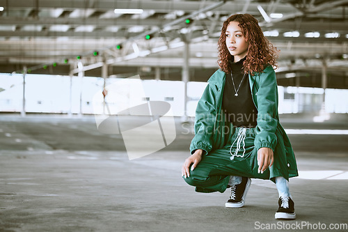 Image of Youth, fashion and black woman with streetwear in an urban city parking lot for design, brand and hip hop lifestyle. Young woman, teenager or fashion model in designer clothes and sneakers outdoor