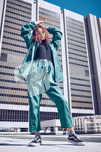 Image of Black woman, hip hop fashion and city gen z girl with urban style, designer streetwear and edgy clothing. Modern clothes, portrait of confident street model and posing by town building in Brazil sun