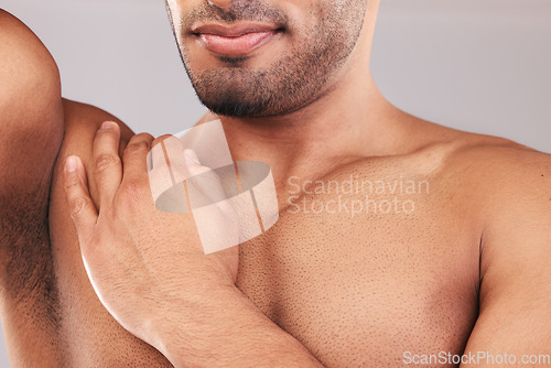 Image of Beard, armpit and body skincare of man in studio isolated on a gray background. Hygiene, grooming and chest hair removal of muscular male fitness model, waxing and cleaning for wellness and beauty.