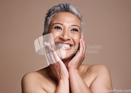 Image of Skincare, anti aging and portrait of mature woman with smile on her face on studio background. Beauty, botox and collagen, happy middle aged lady from India with health, wellness and natural makeup.