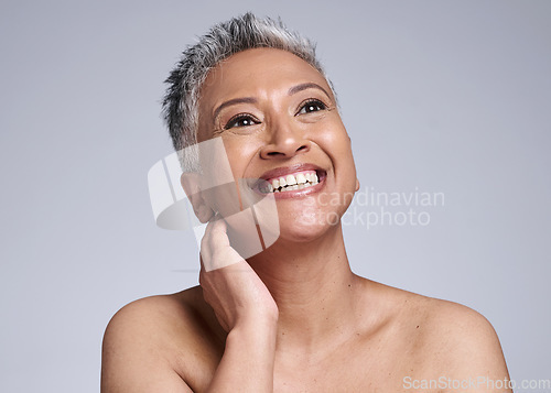 Image of Face, beauty and antiaging with a senior woman in studio on a gray background to promote natural skincare. Wellness, luxury and cosmetics with a mature female posing for dermatology skin treatment