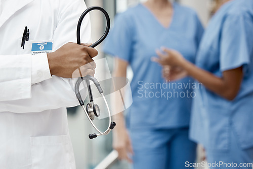 Image of Healthcare, medicine and doctor with stethoscope in hand and boss at hospital or clinic cropped. Help, success and support, confident team leader medical professional or health care employee at work.