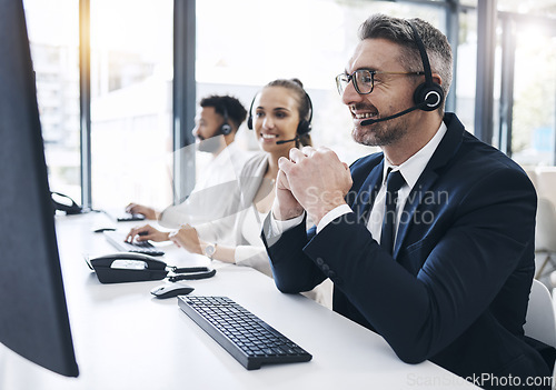 Image of Call center, man and customer service with contact us, telemarketing advice in crm support office. Computer, headset and male agent consulting for helpline or operator help online in the office