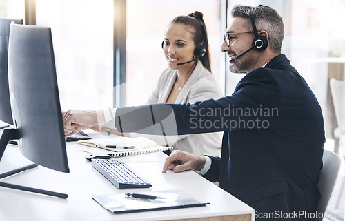 Image of Teamwork, call center and business people in customer service working together in office. Collaboration, team and man looking at computer helping woman in telemarketing, customer care and crm company