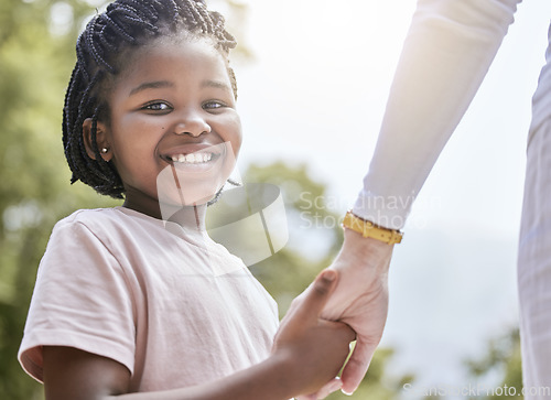 Image of Portrait, adoption and family holding hands by mother and child, interracial, love and trust against a nature background. Foster child, hand and help from foster parent, happy and safety in Africa