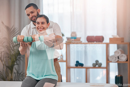 Image of Physiotherapy, dumbbell and exercise by woman for recovery, rehabilitation and healing with physiotherapist. Physical therapy, girl and weight training for osteoporosis, accident and bone treatment