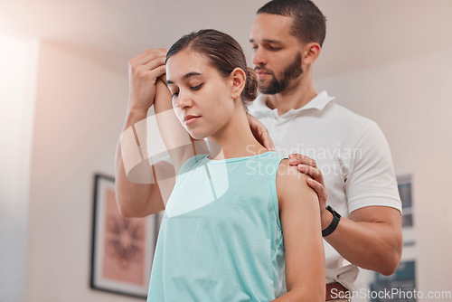 Image of Physiotherapy, arm and woman consulting physiotherapist for injury, problem and osteoporosis in consultation room. Chiropractor, stretch and exam by chiropractor for bone, shoulder and rehabilitation