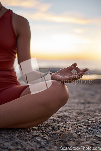 Image of Hand, woman and yoga at the beach at sunset, zen and relax exercise, mudra and chakra training with mockup. Meditation, hands and girl meditating at the sea, peace and energy in nature environment