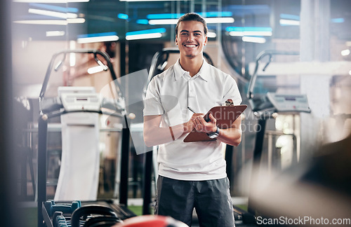 Image of Gym, fitness and portrait of a personal trainer with a clipboard for a training consultation. Happy, smile and sports coach or athlete with a wellness, health and exercise checklist in workout center