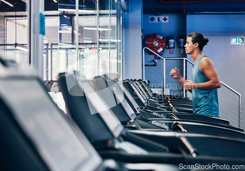 Image of Running, fitness and man exercise on treadmill in gym workout, training or healthy cardio health, wellness and energy. Zoom, male and sports marathon athlete running in fitness practice for race