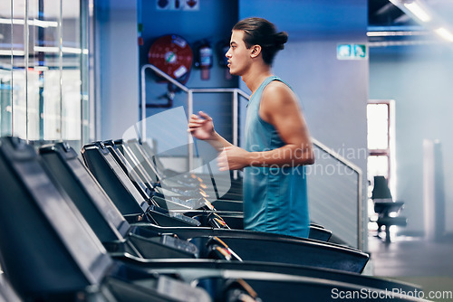 Image of Treadmill, running and profile of man in gym for cardio workout and heart health. Fitness, sports and male runner on machine practicing for marathon, race or training for wellness in fitness center.
