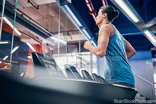 Image of Gym, fitness and man running on treadmill for health, wellness and cardio exercise, alone and power. Runner, workout and guy at sports center for training, energy and endurance, speed and performance