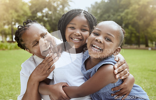 Image of Love, black family hug and grandmother with children enjoy outdoor quality time together, peace or nature park freedom. Fun kids, bond and portrait of excited sisters play with grandma on grass field