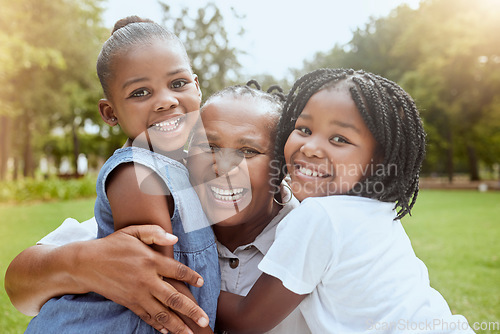 Image of Park, black family and portrait of children with grandmother bonding, smiling and having fun. Summer, love and grandma embrace and hug girls for quality time on weekend, holiday and vacation outdoors