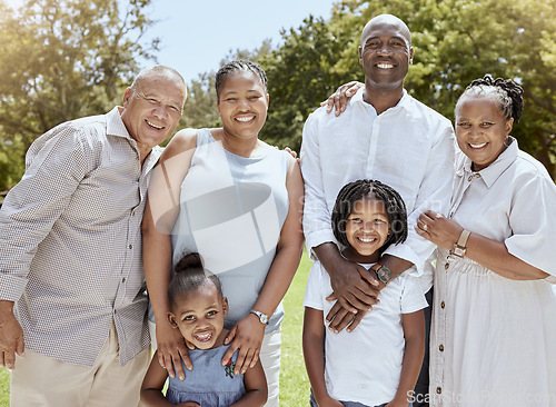 Image of Portrait of happy black family with smile in park, garden or outdoor picnic venue. Men, women and kids together on grass at family event and making memories, generations with girl children and couple