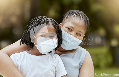 Image of Black mother, girl and covid face mask at park for health, safety and protection from virus infection. Family, love and covid 19 compliance, mom bonding and care with child outdoors in nature garden.