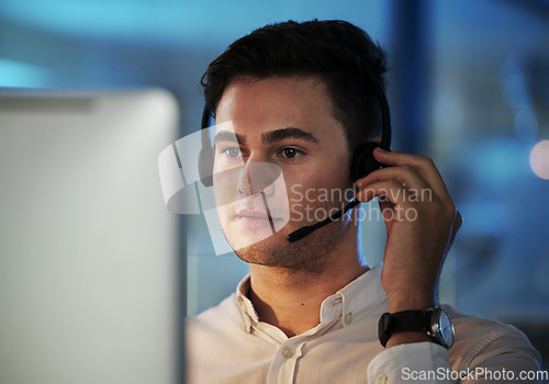 Image of Call center, telemarketing and support with a man consulting using a headset for communication in his office. Contact us, crm and customer service with a male consultant working in retail or sales