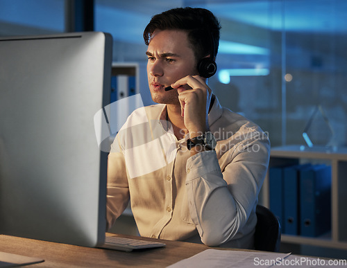 Image of Businessman, telemarketing and consulting working at night in the office for customer service or advice. Man in contact us, consultation or help with headset for insurance, investing or communication