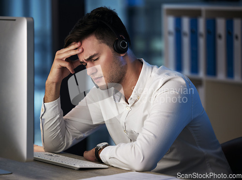 Image of Stress, call center and customer service with a man consultant suffering with burnout while working late at night. Crm, ecommerce and compliance with a male employee working in retail or sales