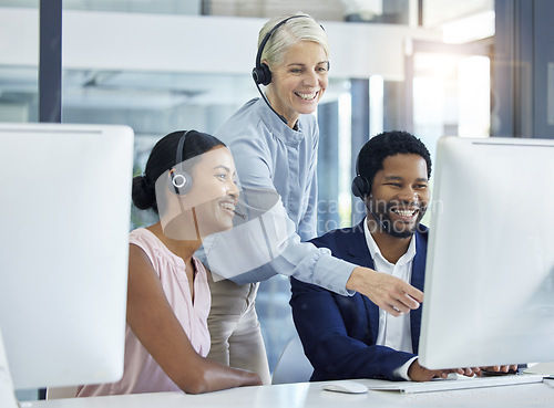 Image of Call center, customer support and manager helping consultants with online consultation in office. Crm, contact us and senior leader consulting telemarketing agents about a ecommerce sale in workplace