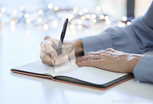 Image of Notebook, pen and hands of old woman writing calendar schedule, checklist or business ideas in planner. Alzheimer, dementia and elderly care person with memory loss takes daily notes on journal paper