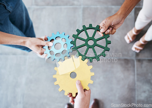 Image of Settings, gear icon and teamwork with business people or team together for collaboration and synergy with cog wheel strategy. Office group hands for problem solving, innovation and development