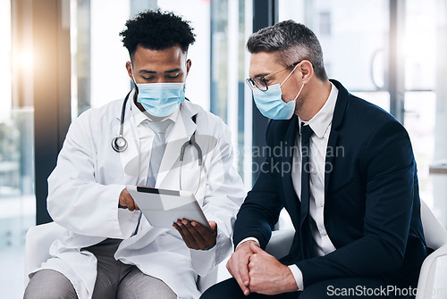 Image of Covid, tablet and doctor with patient results from corona virus test, hospital medical exam or healthcare report. Black man, medicine expert advice and clinic worker consulting man or treatment plan