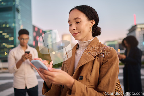 Image of Phone, black woman and city with people using phone technology and 5g web on the street. Young gen z person texting, internet networking and doing a social media app scroll online typing outdoor