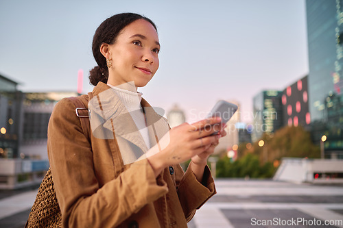 Image of Phone, social media and city with a business black woman walking on a street or road on her evening commute. 5g mobile technology, communication and networking with a female employee in an urban town